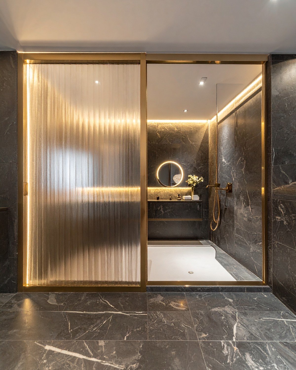 Fluted Glass Partition with Brushed Brass Frame